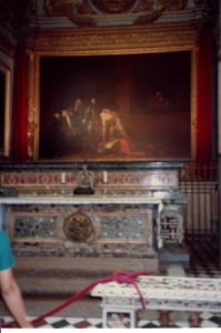 Ornate altar with large religious painting.