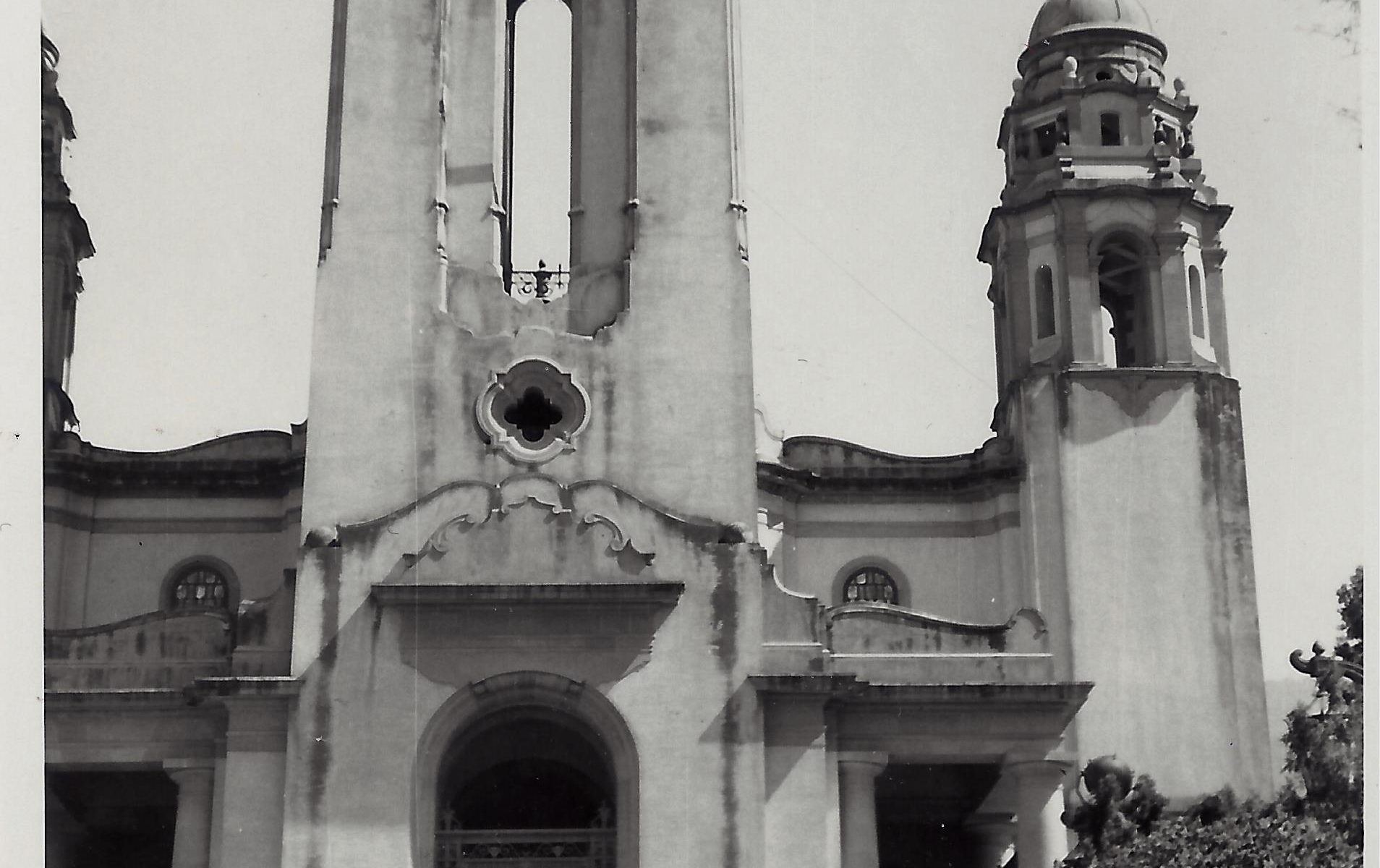 A black and white photo of an old church.